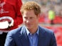 Prince Harry presents awards during the 32nd Virgin London Marathon in London on April 22, 2012