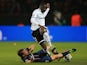 Paris Saint-Germain's Clement Chantome and Valencia's Aly Cissokho battle for the ball on March 6, 2013