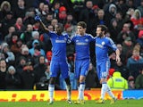 Ramires is congratulated by team mates Oscar and Juan Mata after scoring the equaliser against Manchester United in the FA Cup quarter final on March 10, 2013