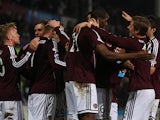 Hearts midfielder Ryan Stevenson is congratulated by team mates after scoring the opener against St Johnstone on March 5, 2013