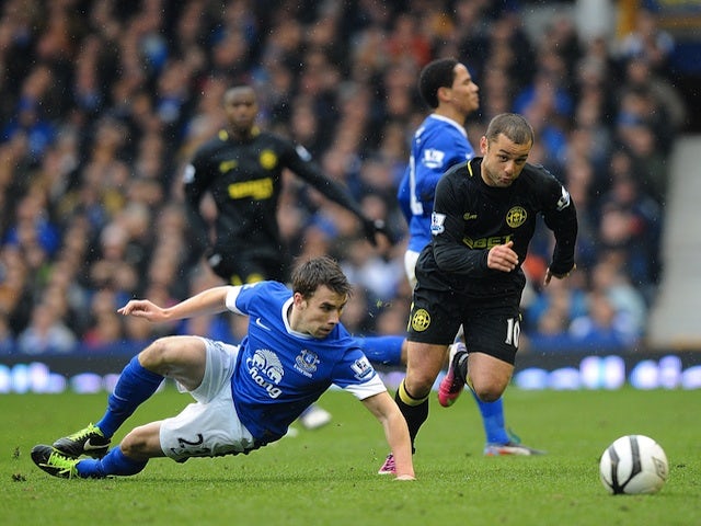 Wigan's Shaun Maloney skips past Everton's Seamus Coleman during the game on March 9, 2013