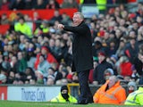 Manchester United boss Sir Alex Ferguson gestures to his team from the touchline during the FA Cup quarter final clash with Chelsea on March 10, 2013