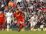 Steven Gerrard slots home a penalty and his team's third against Spurs on March 10, 2013