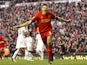 Steven Gerrard celebrates scoring a penalty and the winner against Spurs on March 10, 2013