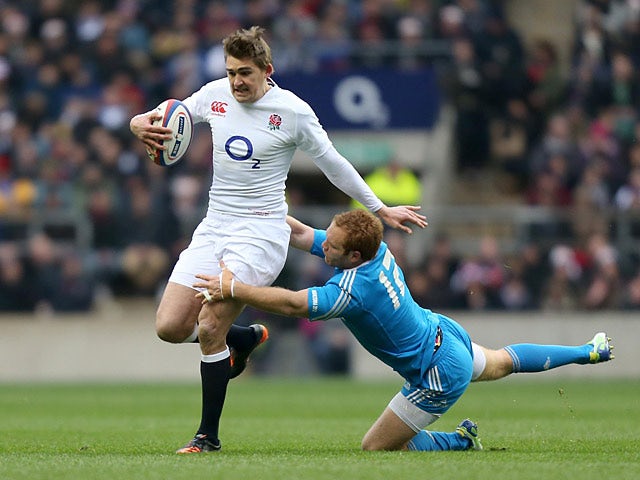 England's Toby Flood is tackled by Italy's Gonzalo Garcia on March 10, 2013