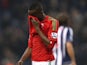 Swansea City's Roland Lamah looks dejected after his side's defeat to West Brom on March 9, 2013