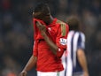 Swansea City's Roland Lamah looks dejected after his side's defeat to West Brom on March 9, 2013