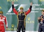 Lotus driver Kimi Raikkonen on the podium after winning the Australian Formula One Grand Prix on March 17, 2013