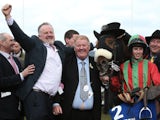 Benefficient's owners and jockey celebrate after a win at Cheltenham on March 14, 2013