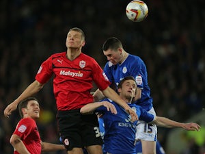 Cardiff City's Ben Nugent wins header beating Leicester City pair Andy King and Michael Keane during the Championship clash on March 12, 2013