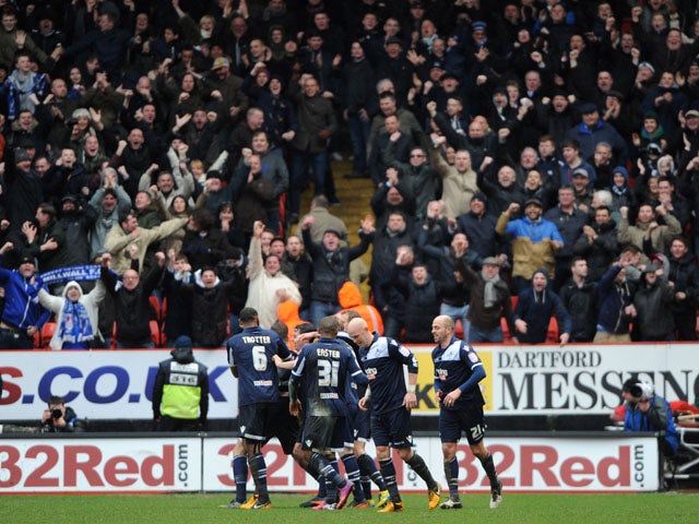 Millwall players celebrate following the second goal in their match against Charlton Athletic on March 16, 2013 