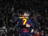 Barca forward David Villa hugs Lionel Messi after the Spaniard scored against Rayo Vallecano on March 17, 2013