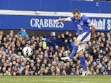 Everton's Leon Osman scores the opening goal in his side's match against Manchester City on March 16, 2013