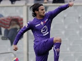 Fiorentina's Alberto Aquilani jumps in celebration after scoring against Genoa on March 17, 2013