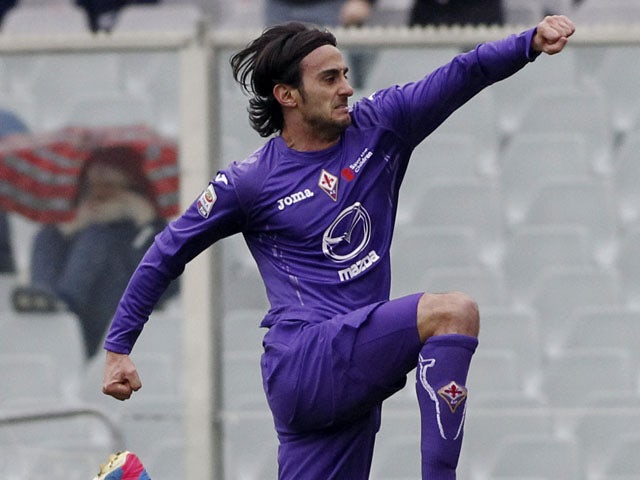 Fiorentina's Alberto Aquilani jumps in celebration after scoring against Genoa on March 17, 2013