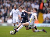 Leeds United's Samuel Byram slides in on Huddersfield Town's Paul Dixon during the Campionship clash on March 16, 2013