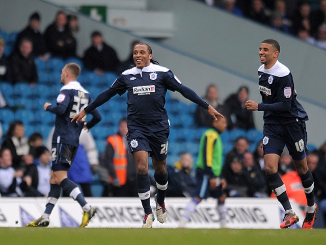 Huddersfield Town's Neil Danns celebrates after scoring his team's opening goal in their Championship clash with Leeds United on March 16, 2013