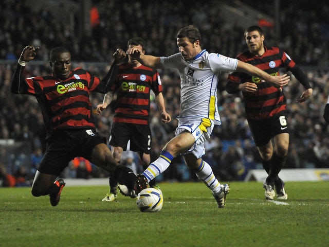 Leeds United's David Norris and Peterborough United's Gabriel Zakuani battle for the ball during the Championship match on March 12, 2013