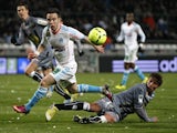 Marseille's midfielder Mathieu Valbuena challenges for the ball with Ajaccio's Mehdi Mostefa on March 15, 2013