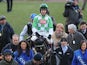 Wayne Hutchinson celebrate on Medinas after winning the Coral Cup at the 2013 Cheltenham Festival on March 13, 2013