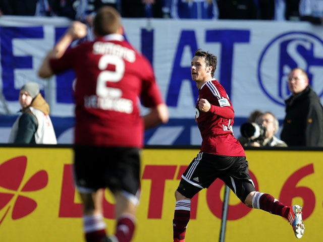 Nuremberg's Markus Feulner celebrates after scoring against Schalke on March 16, 2013