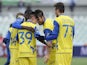 Chievo players celebrate following Adrian Marius Stoian's goal in their game against Pescara on March 17, 2013