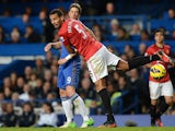 Manchester United's Rio Ferdinand battles for the ball with Chelsea's Fernando Torres on October 28, 2012