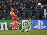 Galatasaray's Burak Yilmaz scores past Schalke goalkeeper Timo Hildebrandon March 12, 2013