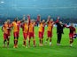 Galatasaray's players celebrate at the end of the game after knocking Schalke out of the Champions League on March 12, 2013