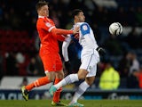 Millwall's Shane Lowry and Blackburn's Leon Best battle for the ball during their FA Cup quarter final clash on March 13, 2013