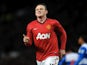 United's Wayne Rooney celebrates a goal against Reading on March 16, 2013