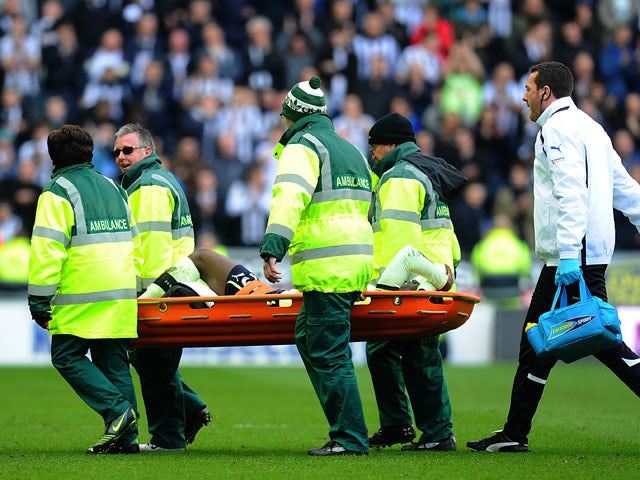Newcastle United's Massadio Haidara is carried from the field on a stretcher after picking up an injury during his side's match against Wigan on March 17, 2013