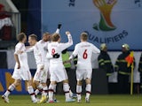Denmark's players celebrate after a goal during their World Cup qualifiying match against the Czech Republic on March 22, 2013
