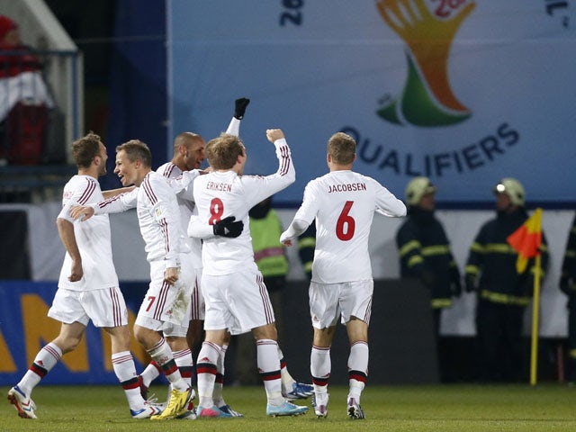 Agger penalty earns Denmark draw
