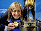 Scotland's skip Eve Muirhead poses with the trophy after winning the 2013 world women's curling championship on March 24, 2013
