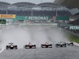 F1 drivers go round a corner at an early stage of the Malaysian Grand Prix on March 24, 2013