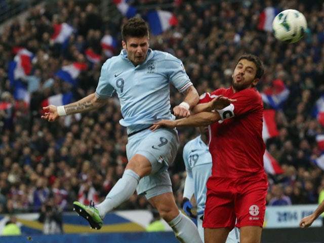 France's Olivier Giroud heads the opening goal of his side's World Cup qualifiying match with Georgia on March 22, 2013