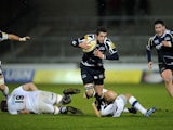 Sale Sharks' Nick Macleod is tackled by Bath's Peter Stringer during the Aviva Premiership on March 22, 2013