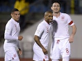 England's Jermaine Defoe celebrates scoring against San Marino during the World Cup qualifier on March 22, 2013