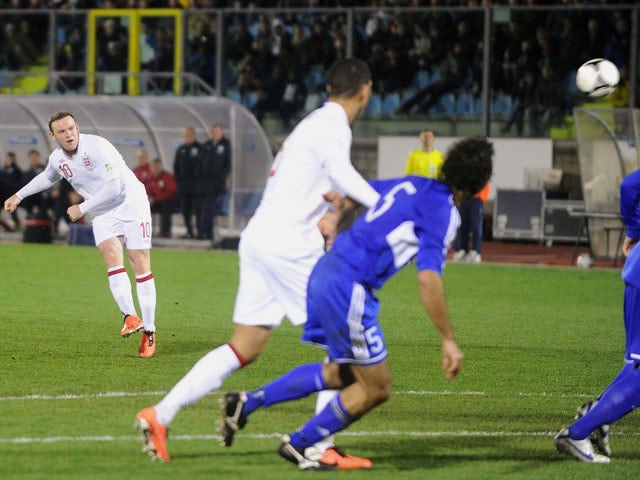 England's Wayne Rooney scores a freekick during his side's World Cup qualifier against San Marino on March 22, 2013