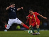 Wales' Craig Bellamy battles for the ball with Scotland's Grant Hanley during the World Cup qualifiying match on March 22, 2013