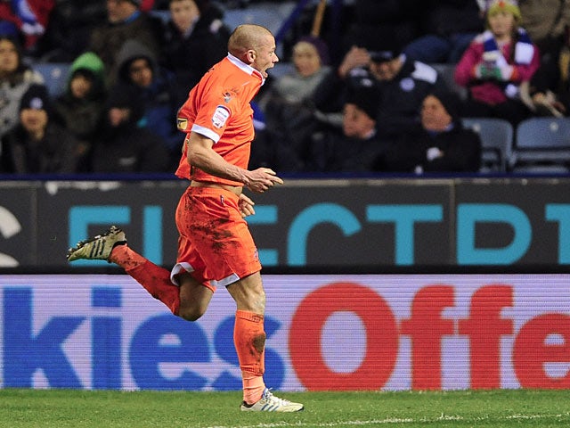 Millwall's Alan Dunne celebrates after scoring the winner against Leicester on March 29, 2013