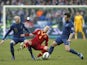 Spain's Andres Iniesta is challenged by two French players on March 26, 2013