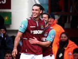 Andy Carroll is congratulated by team mate Matt Jarvis after scoring his second against West Brom on March 30, 2013