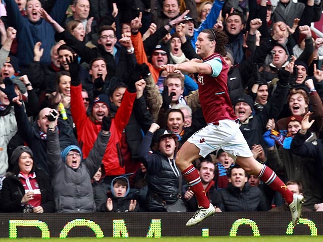 Andy Carroll celebrates after scoring the opening goal against West Brom on March 30, 2013