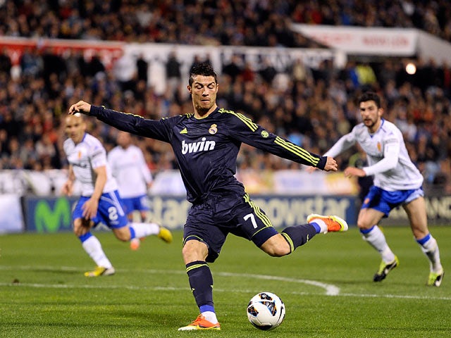 Real's Cristiano Ronaldo scores the equaliser during the match against Real Zaragoza on March 30, 2013