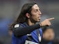 Inter Milan's Ezequiel Schelotto reacts after his side's match against AC Milan on February 24, 2013