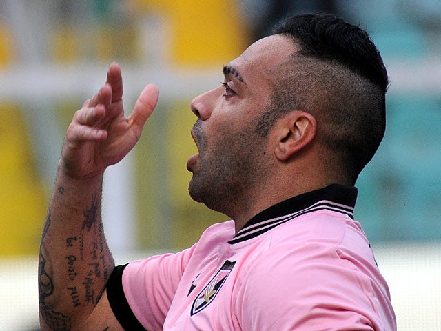 Palermo's Fabrizio Miccoli celebrates his goal against Roma on March 30, 2013