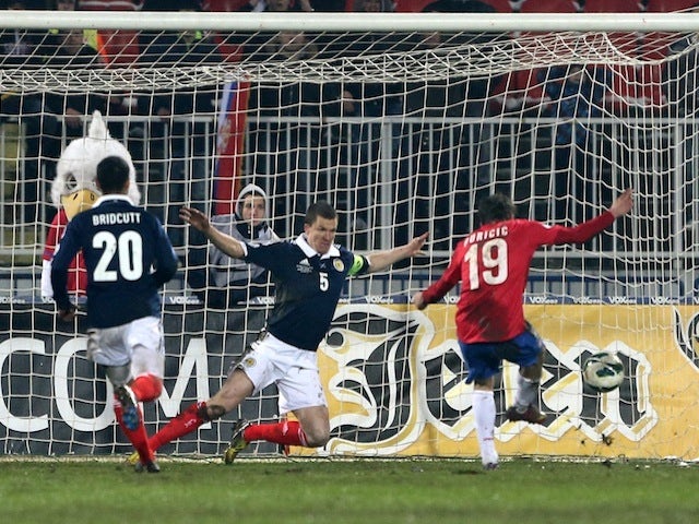 Serbia's Filip Duricic scores against Scotland on March 26, 2013