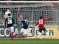 Serbia's Filip Duricic scores against Scotland on March 26, 2013